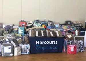 a printed Harcourts table cover