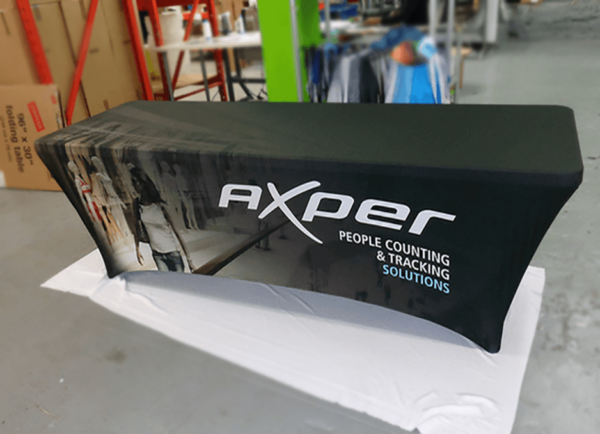 a stretch tablecloth with logo in black