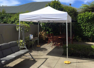 enjoy garden dining in a white gazebo