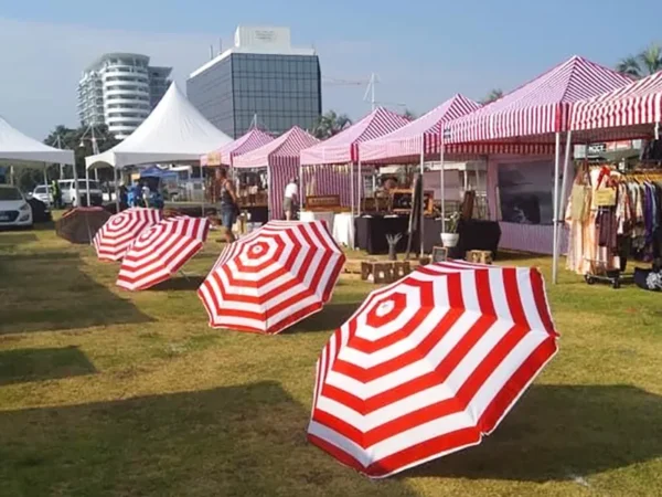 striped gazebos with umbrellas