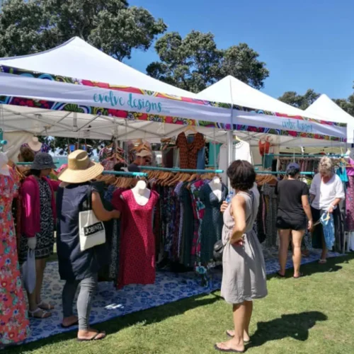 a pop up gazebo with sign in white