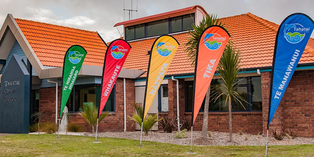 Custom school flags for Tahatai Coast School