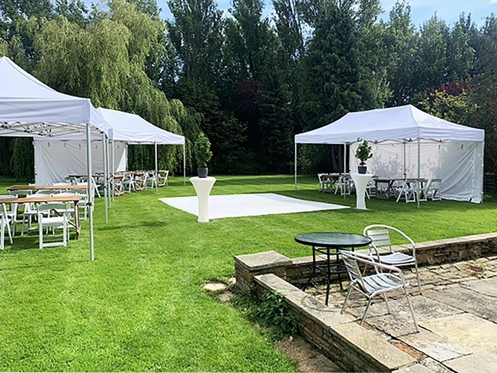 a wedding gazebo standing on a beautiful lawn