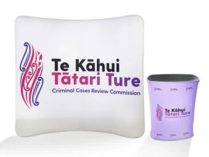 Tension fabric curved display wall with a counter for Te Kahui Tatari Ture
